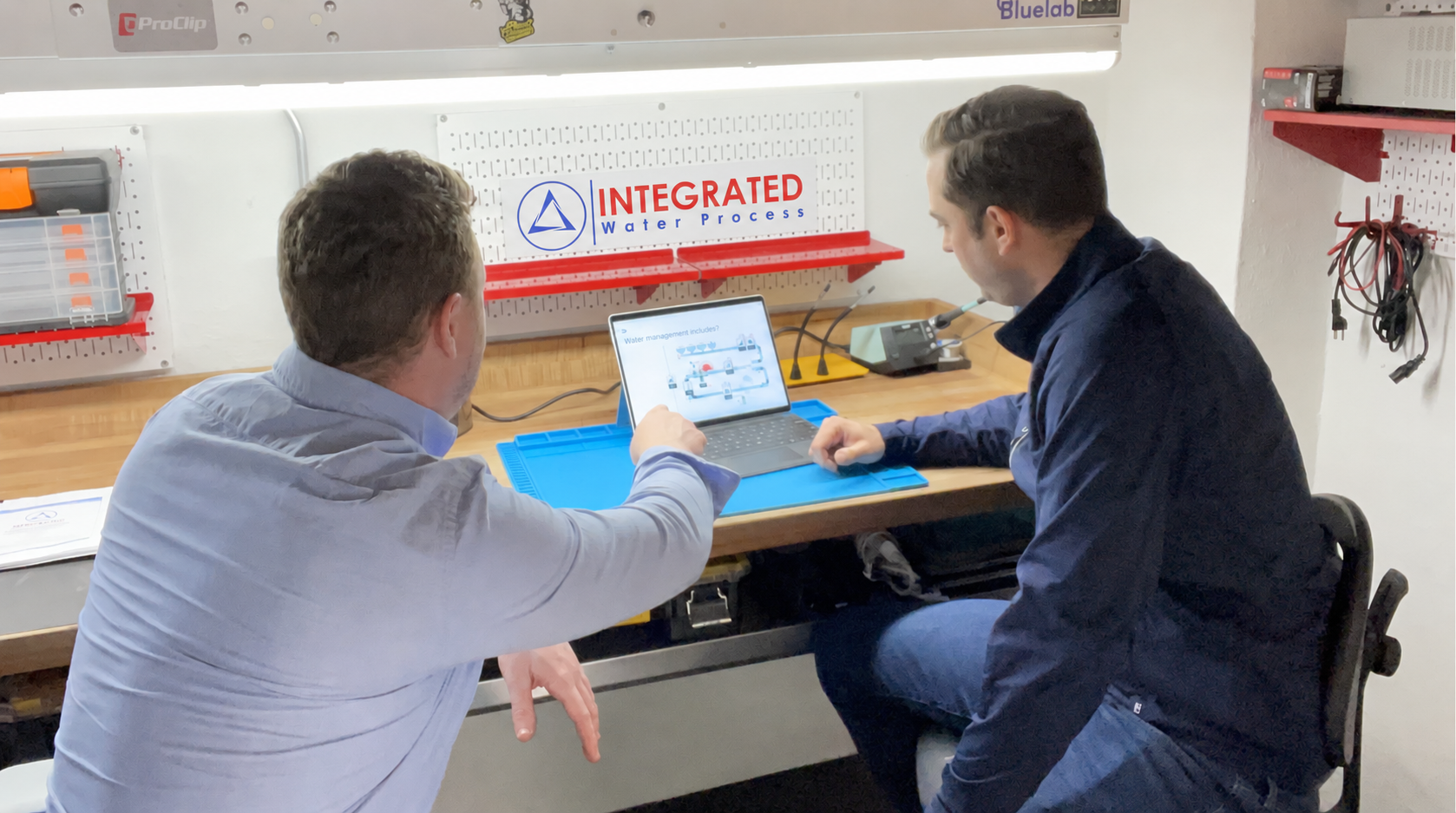 Engineers reviewing a commercial hydroponic water system design
